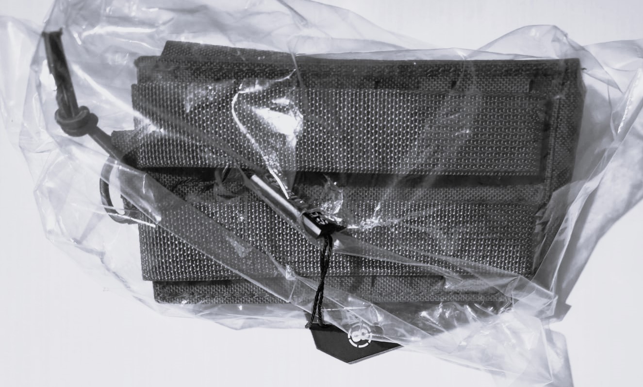 A real photo of Single Magazine Pouch AR15/AK Laser-Cut 8Fields Black by Mack (3)