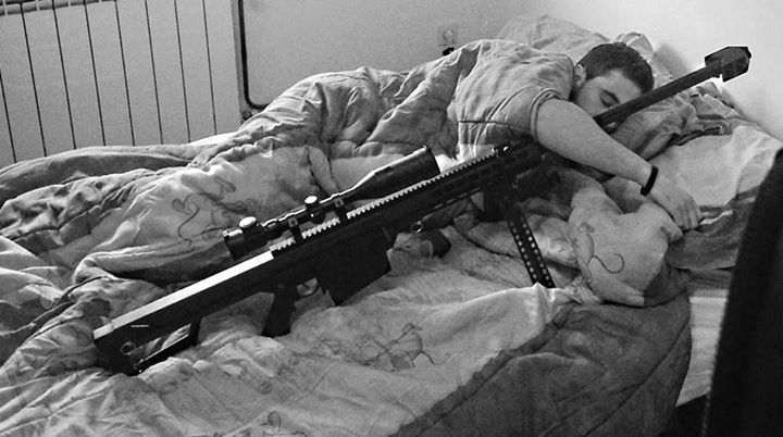 Man sleeping in bed with an airsoft gun